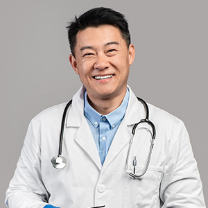smiling-confident-adult-chinese-man-therapist-in-w-J7RKPHF